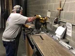 Operator at chop saw