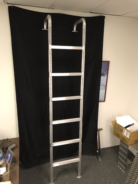 Vertical fire truck ladder with double hook mount